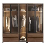 A modern Dressing Room with a sleek design, featuring glass doors, multiple hanging areas, and built-in drawers for organized storage